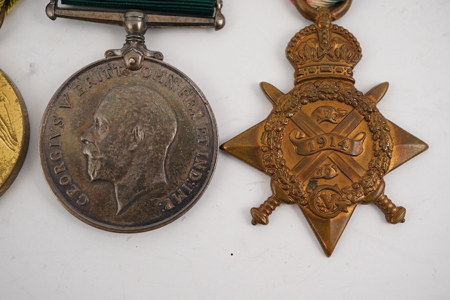 A First World War medal trio and Naval Reserve Long Service medal awarded to R.E.A. Lawrence ENGN RNR. Condition - fair.